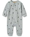 Long-sleeved jumpsuit for babies with a wheat signature print and penguin patterns, featuring press buttons down the front and along the inseam.