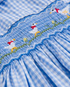Blue checkered fabric with embroidered birds and flowers