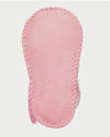 Pink baby bootie on a light gray background