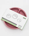 Pink divided plate with Green Sprout packaging on a white background