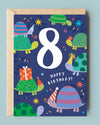 Children's birthday card with turtles and number 8 on a blue background
