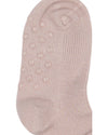 Beige sock with textured sole on a white background