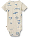 Beige baby onesie with blue ocean-themed patterns on a white background