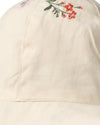 Beige cap with floral embroidery on a white background