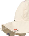 Beige bucket hat with floral embroidery on a white background