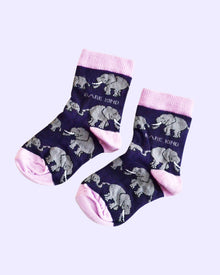  Pair of socks with elephant pattern and pink accents on a light purple background