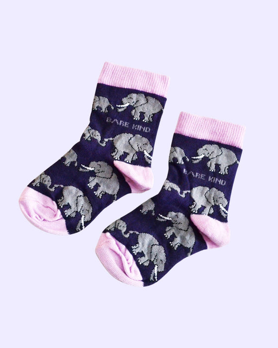 Pair of socks with elephant pattern and pink accents on a light purple background