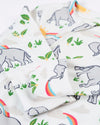 White fabric with gray elephant, rainbow, and green leaf pattern