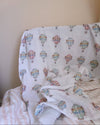 La La Lu Hot Air Balloon cotton muslin baby swaddle blanket in colourful watercolour design.
