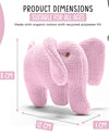Pink knitted elephant toy with dimensions and material information on a white background