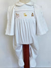 A white baby smocked outfit with a short-sleeve collar, footed pants, and a matching open-front cardigan, displayed on a mannequin against a plain light background.