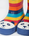 Colorful striped rain boots with panda faces on a white background