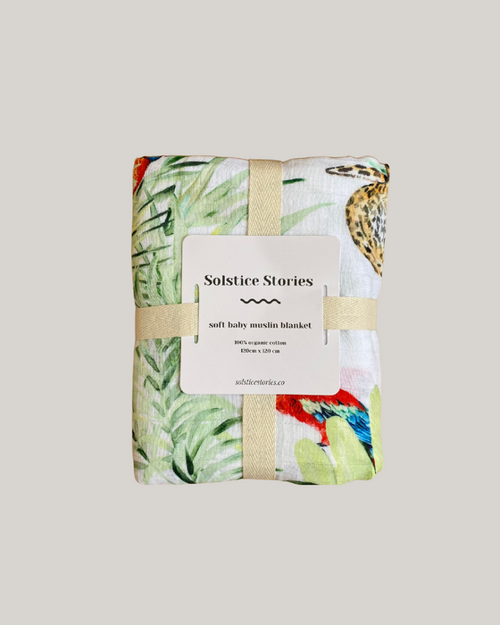 Baby blanket with a colorful pattern on a light gray background