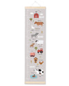 Children's growth chart with farm animal illustrations on a gray background