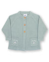 Green baby cardigan with bear patches on a white background