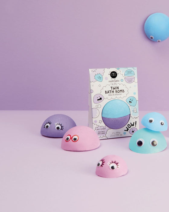 Colorful bath bombs with googly eyes on a purple background