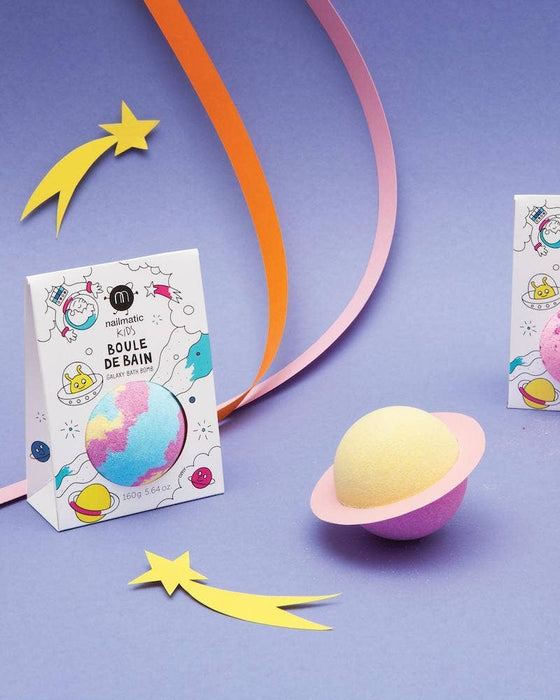 Bath bomb with packaging on a purple background with decorative ribbons and stars.