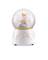A white music snow globe with a decorated base featuring gold and silver fairy illustrations, containing a miniature fairy figurine and glittery snow inside a clear sphere.