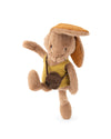 A plush toy rabbit character in a yellow outfit with a brown hat and small brown bag, posed against a plain white background.