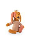 A plush stuffed dog toy sitting on a white background. The dog is golden brown with pink inner ears, pink paws, and a pink-tinted snout, wearing a beige and brown striped turtleneck sweater.