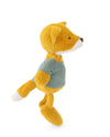 A plush toy fox wearing a muted sage green shirt, standing in profile against a clean white background.