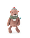 A plush toy otter wearing a green knit scarf and a striped beanie with a red pom-pom, standing against a plain white background.