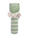 Green knitted toy with a ruffled collar on a white background