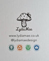 Logo and branding elements for Lydia Mae on a textured gray background