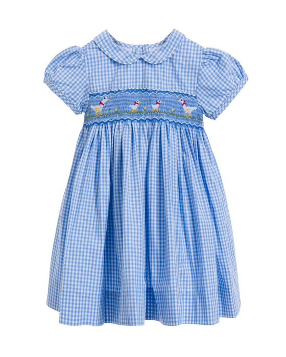 Blue checkered dress with smocked neckline on a white background
