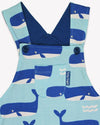 Children's dress with whale pattern on a light blue background