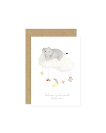  A baby greeting card with an illustration of an elephant, moon, rainbow, owl, and stars on a cloud mobile. The card has a beige background and a blank inside for a personal message.
