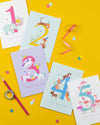 Five birthday cards with numbers 1 to 5 on a yellow background