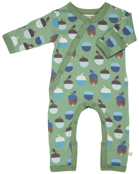 Green baby romper with acorn pattern on a white background