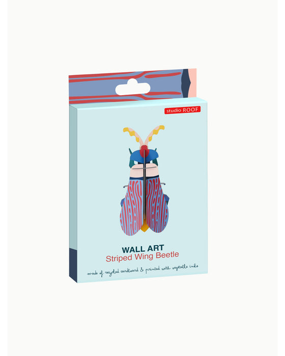 Packaged wall art of a striped wing beetle on a light blue background