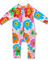 Colorful children's onesie with floral and smiley face pattern on a white background