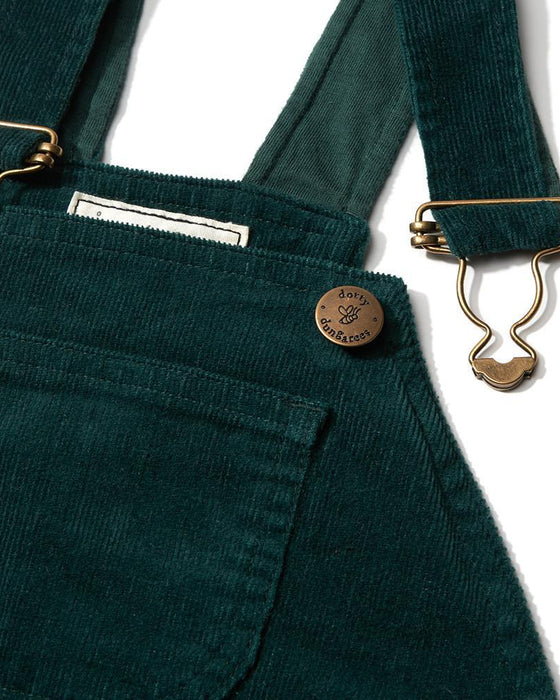 Green corduroy overalls with gold buttons and suspenders on a white background