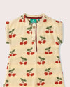Children's sleeveless jacket with cherry pattern on a light background