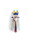A colorful 3D papercraft beetle sculpture viewed from directly above on a solid white background.