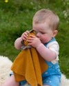 Little Green Radicals Golden Lion organic cotton muslin baby comforter.
