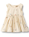 Beige dress with floral embroidery on a white background