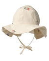 Beige sun hat with floral embroidery on a white background