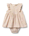 Floral baby dress and bloomers set on a white background