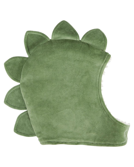 Green dinosaur-shaped cushion on a white background