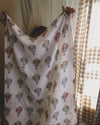 La La Lu Hot Air Balloon cotton muslin baby swaddle blanket in colourful watercolour design.