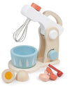 Toy kitchen set with wooden mixer, bowl, and utensils on a white background