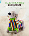 Colorful knitted dog toy with a gentle rattle on a light background