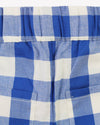 Close-up of blue and white checkered fabric with a pocket.