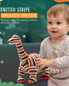 Child holding a colorful striped dinosaur toy with promotional text on a green background