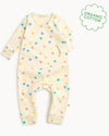 Baby onesie with colorful star pattern on a white background, featuring an 'Organic Cotton' label.