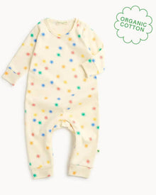  Baby onesie with colorful star pattern on a white background, featuring an 'Organic Cotton' label.